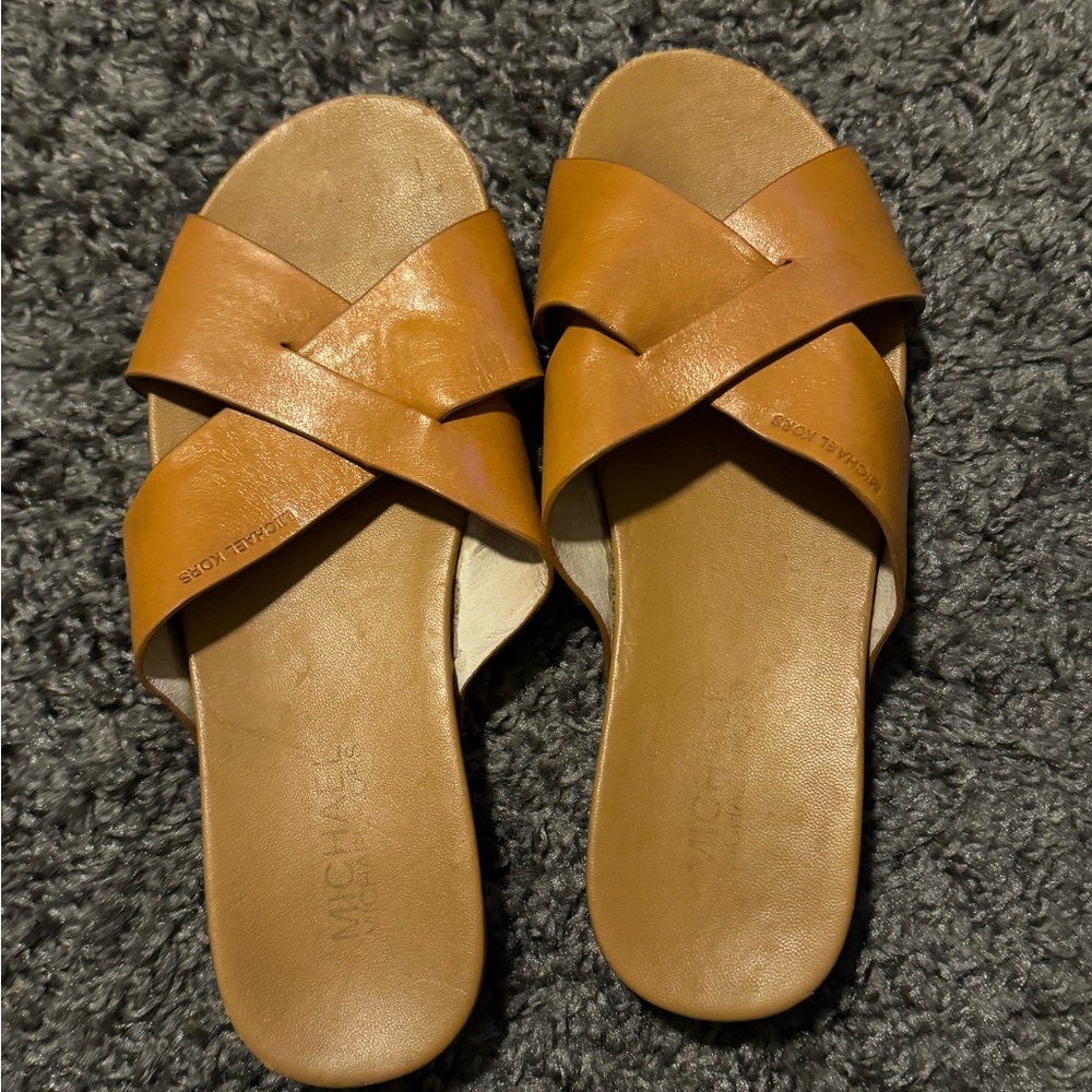 Michael Kohrs cross sandals.